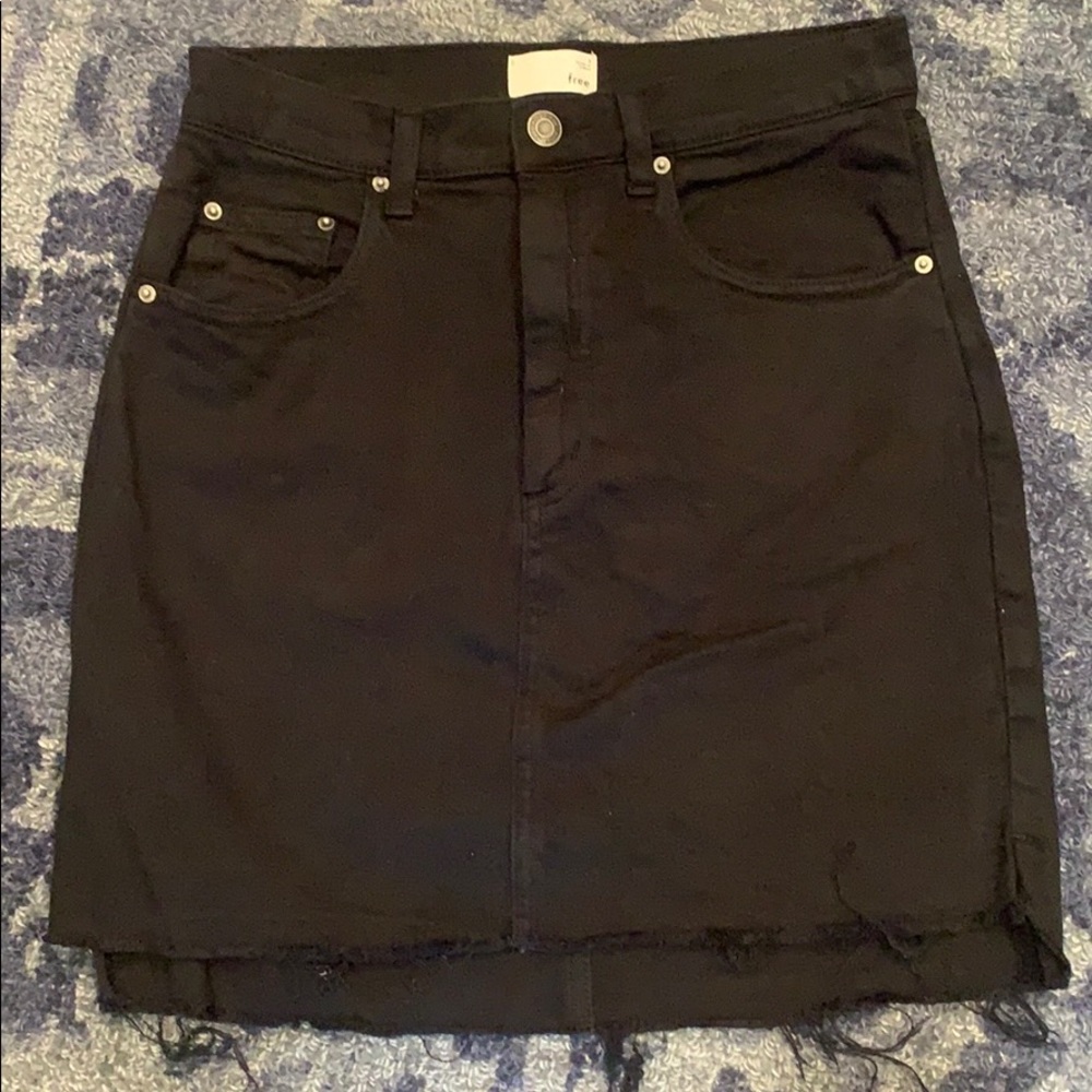 Stretch denim skirt with a raw cut hem/side slits